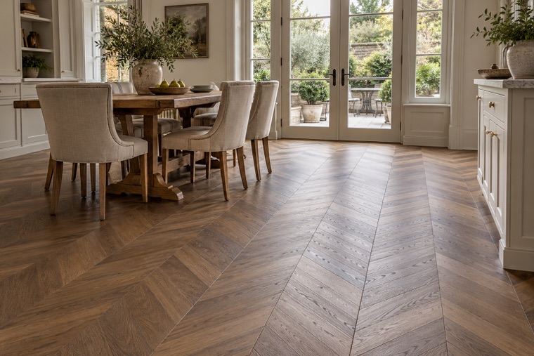 Garden-lit breakfast room with French chevron oak