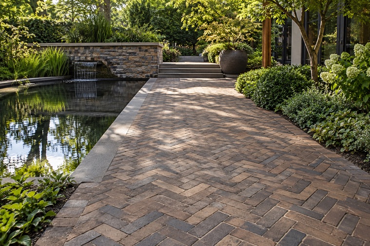 Dappled Herringbone Walkway Beside Reflecting Basin